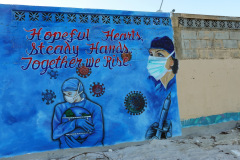 Covid-graffiti längs stranden, San Pedro, Ambergris Caye.