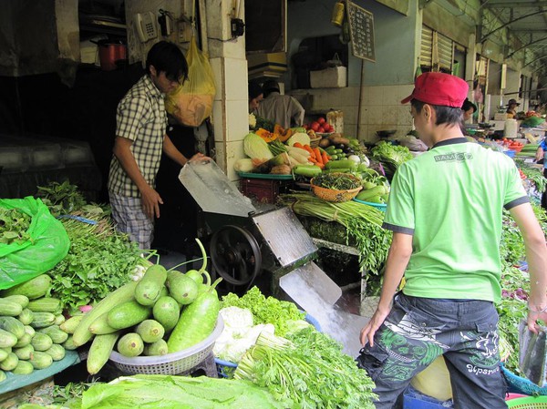 Krossning av is Ben Thanh market, Saigon.